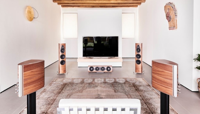 A modern living room with a wood style audio system.