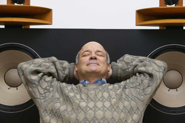 Man Listening to High Quality Audio Speakers