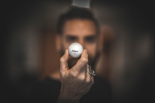 Man Holding a Golf Ball