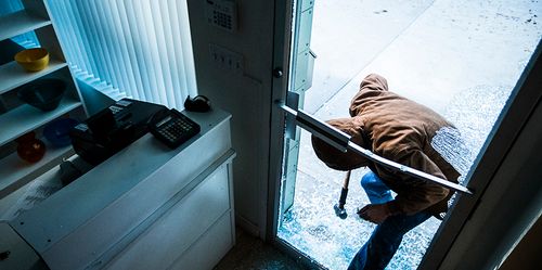 Thief Breaking Into Business