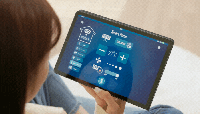 Woman adjusting the thermostat settings and seeing the energy efficiency on her tablet