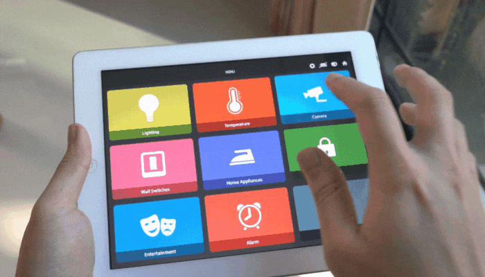 Closeup of someone monitoring their home using smart home security