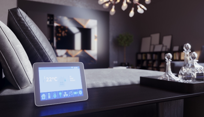 A control panel set in a minimalist bedroom