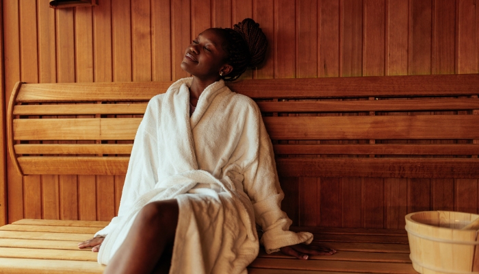 Woman basking in the soft music playing in the spa while she relaxes