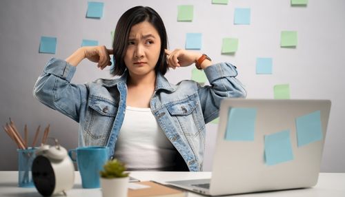 Woman Annoyed by Sound