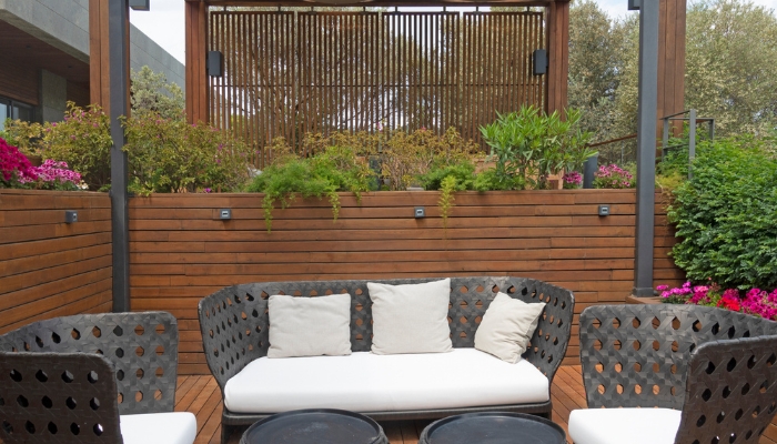 Back patio with small outdoor speakers situated at the top