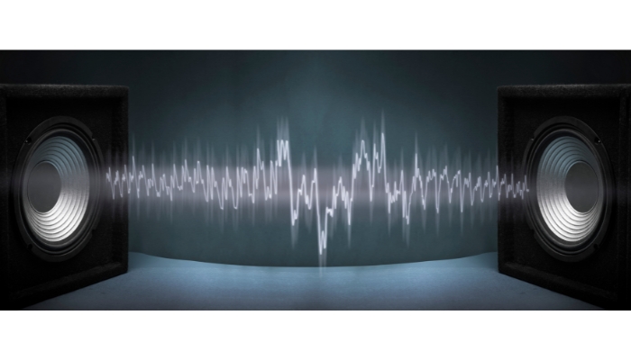 Speakers with audio waves going back and forth