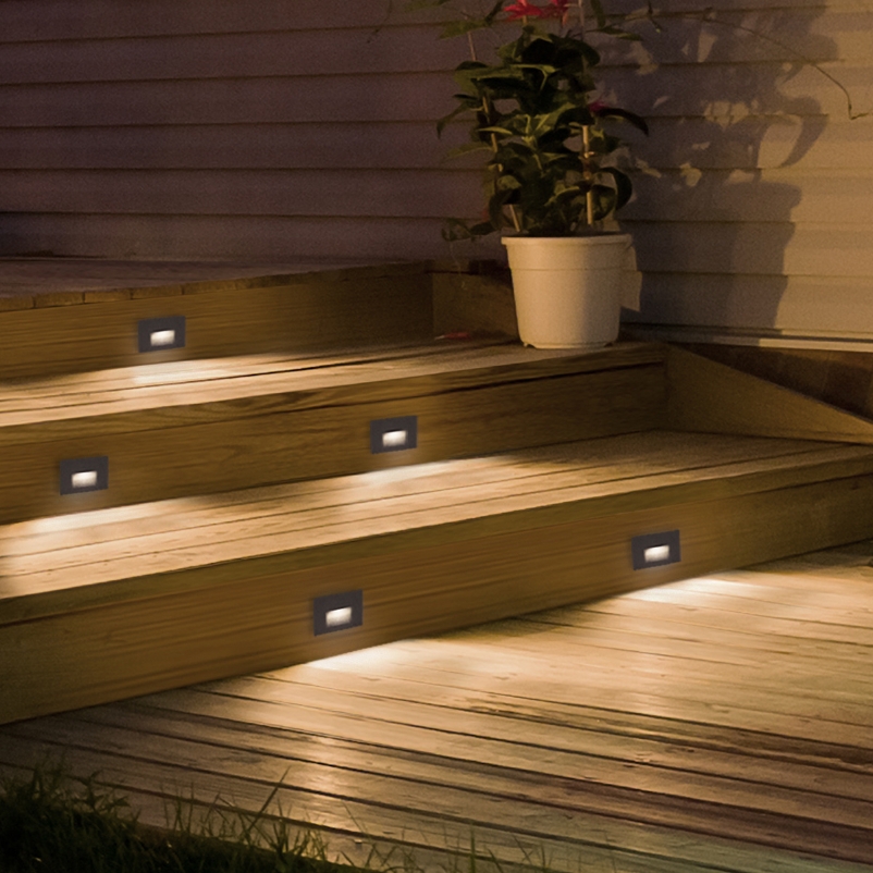 Outdoor steps lit up with small, warm lights.