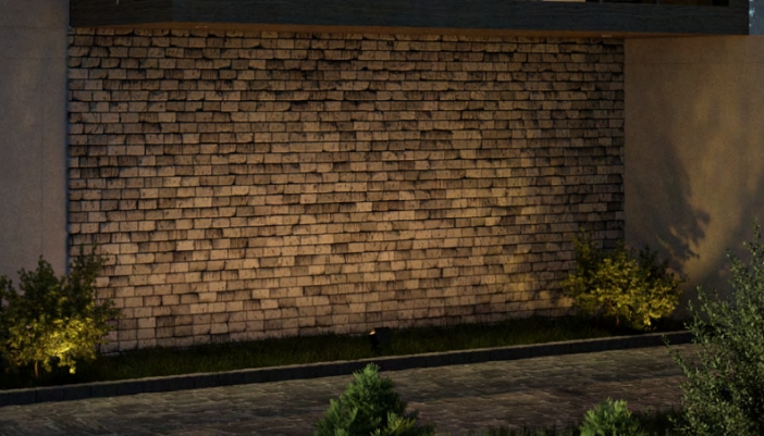 Outdoor lights shining on a brick accent wall. 