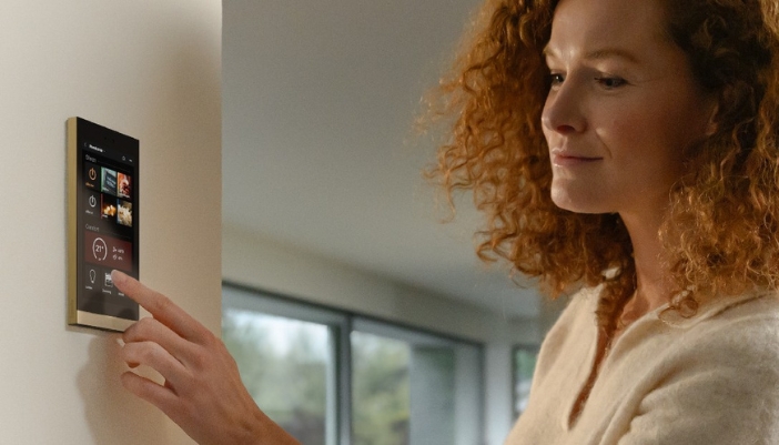 woman touching sleek wall control