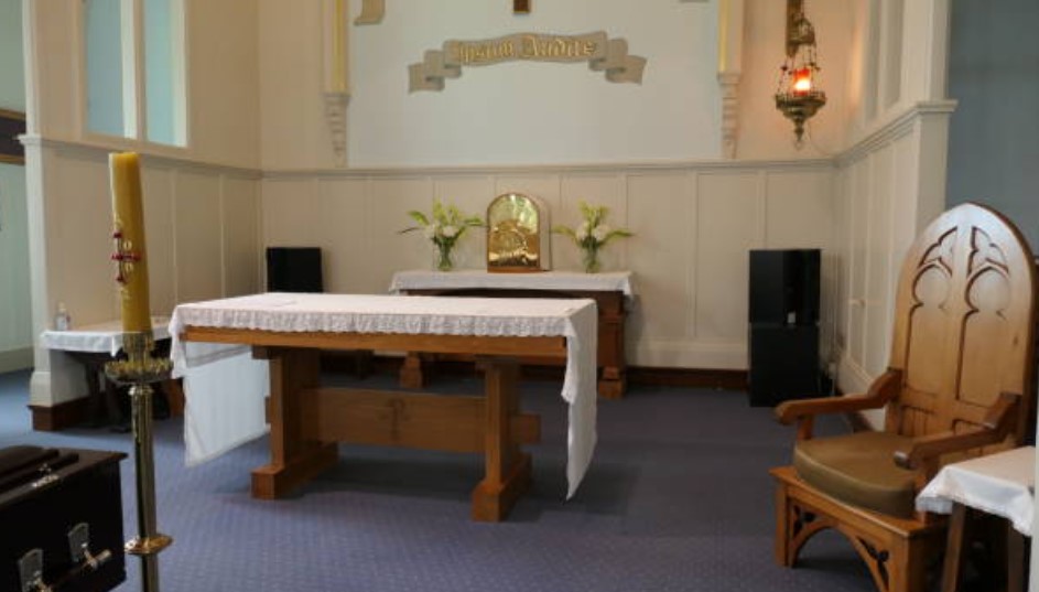 church front with black speakers in the corners