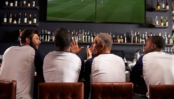 Friends Watching Sports at the Bar
