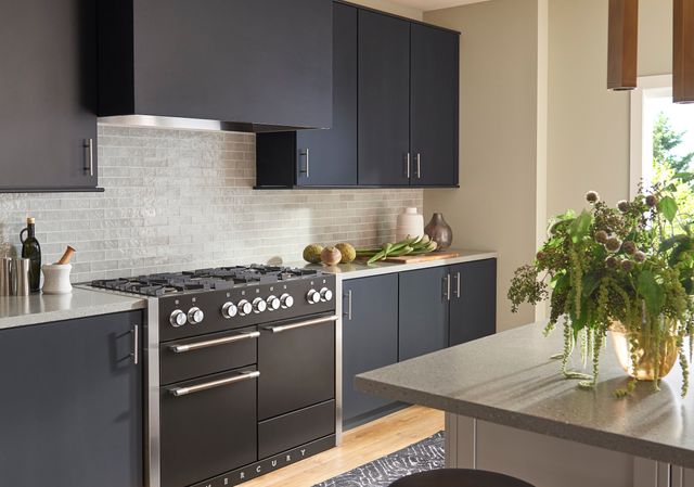 Front view of a black AGA range in a modern minimalistic kitchen