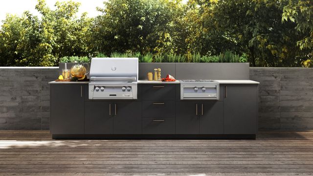 front view of an alfresco outdoor kitchen with a grill and side burner