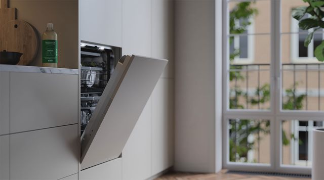 Front view of a built in panel-ready ASKO dishwasher in a modern kitchen