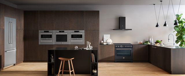 front view of a modern kitchen with three wall ovens built in electric 