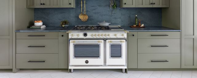 Front view of a modern kitchen with a white Bertazzoni Range