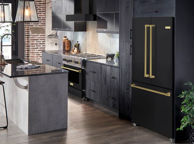 Front view of a rustic kitchen with matte black Bluestar appliances