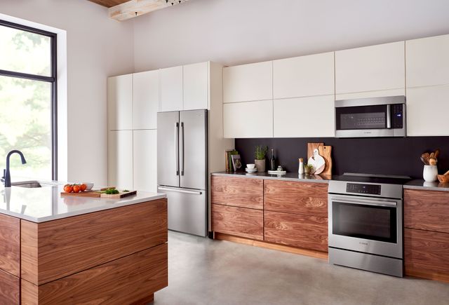 View of a modern kitchen with a Bosch induction range and Bosch refrigerator