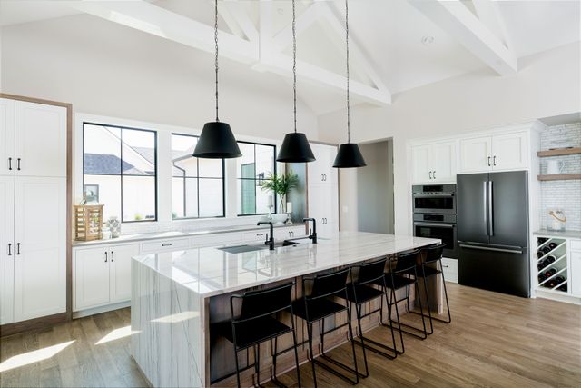 Front view of a modern kitchen with a Bosch refrigerator