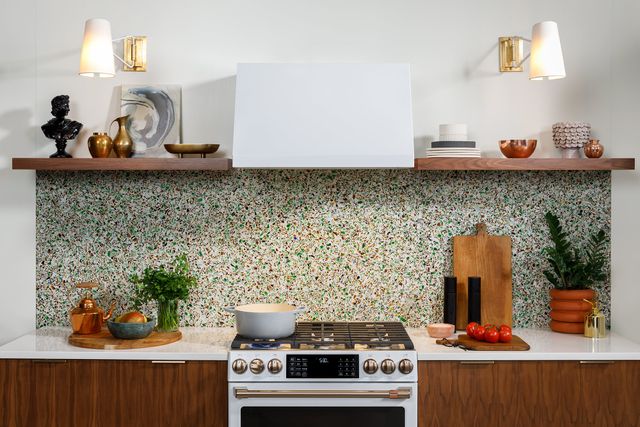 front view of a modern bright kitchen with a white gas cafe range