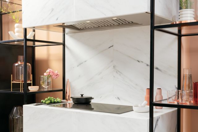 Front view of a modern kitchen with a Cafe induction cooktop