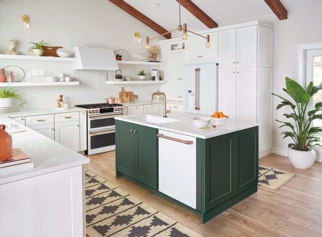 front view of a modern kitchen with white cabinetry and white cafe appliances