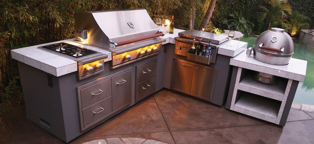 front view of a modern outdoor kitchen with various appliances