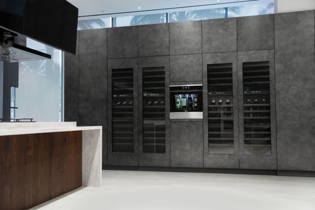 front view of four Dacor built in wine coolers in a luxury kitchen