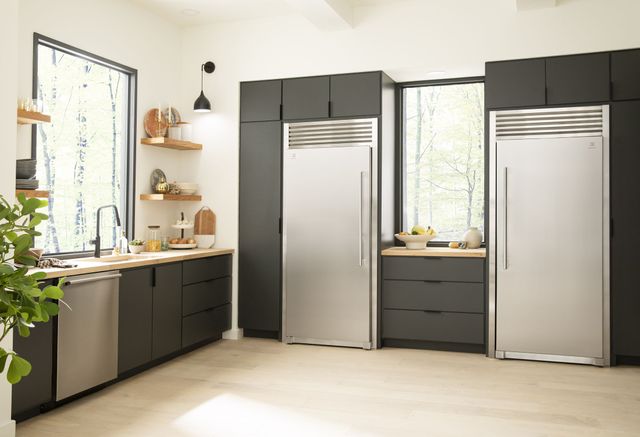 Front view of a luxury kitchen with Electrolux appliances including a column freezer and freezerless refrigerator