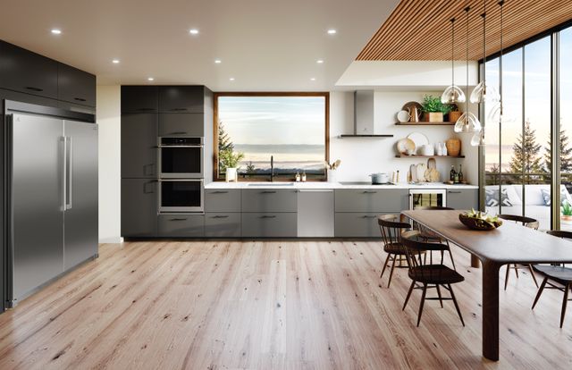 Front view of a modern kitchen with stainless steel Electrolux appliances.