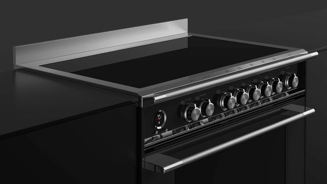 front view of a Fisher and Paykel black induction range with front knobs