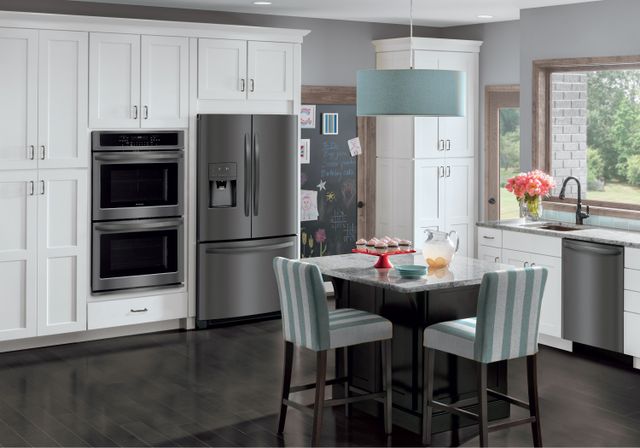 front view of a modern kitchen with black stainless steel frigidaire appliances