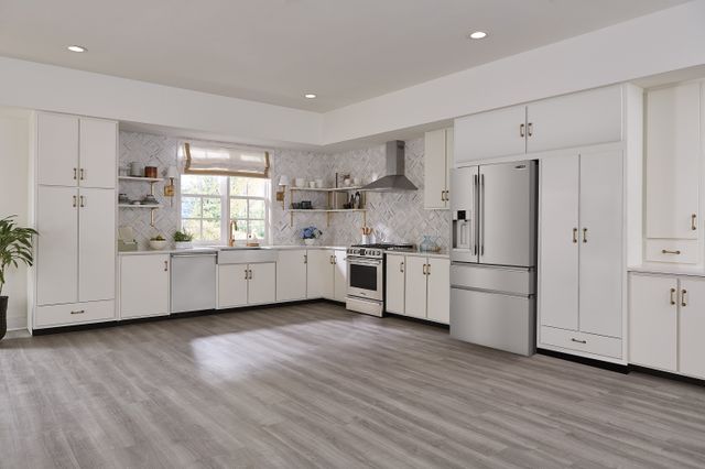 Front view of a modern kitchen with Frigidaire Professional appliances.