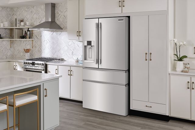Front view of a modern kitchen with a Frigidaire french door built in refrigerator