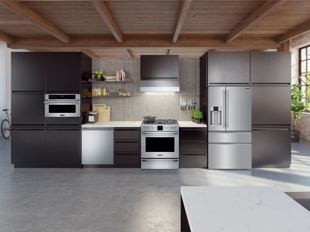 Front view of a modern kitchen with stainless steel Frigidaire Gallery appliances.