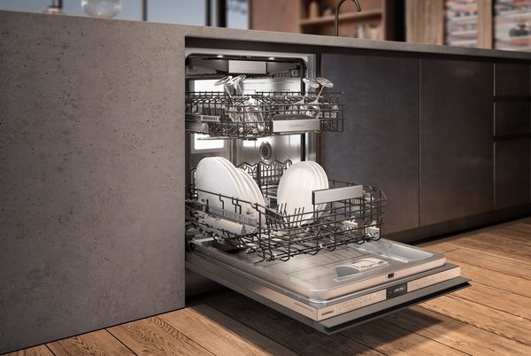 Built in dishwasher open to reveal clean dishes inside