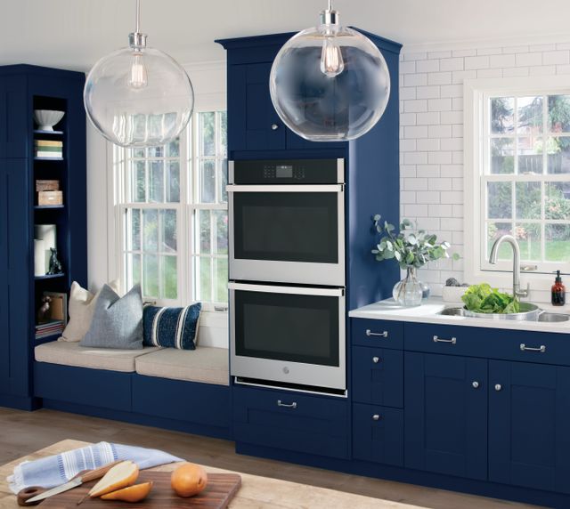 Front view of a modern kitchen with a GE double wall oven