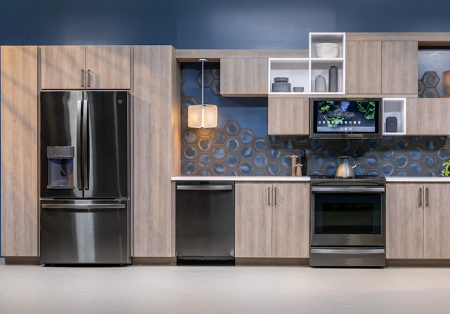 Front view of a modern kitchen with a four piece GE kitchen appliance package