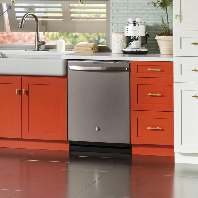 front view of a ge dishwasher built into orange cabinetry