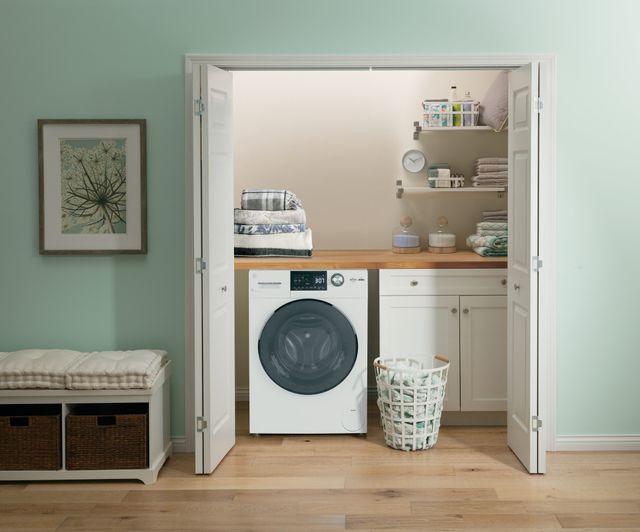 front view of a GE white washer dryer combo in a modern laundry room