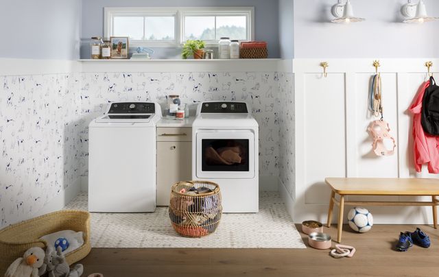 front view of a childrens playroom with a top load washer and front load dryer