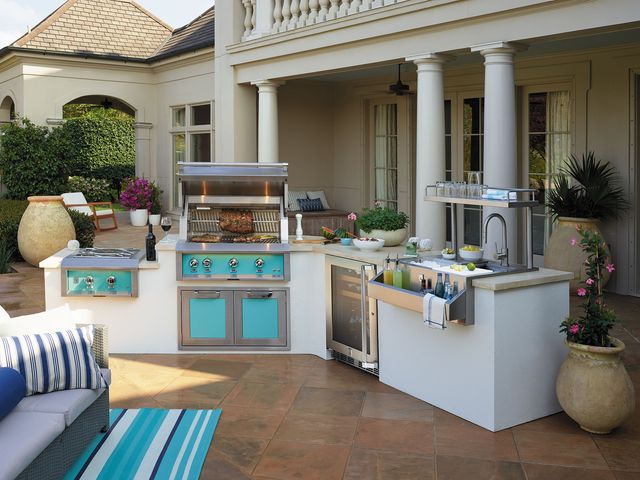 Front view of a modern outdoor kitchen with Hestan appliances.