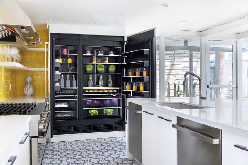 Side by side fridge with black interior in a luxury kitchen