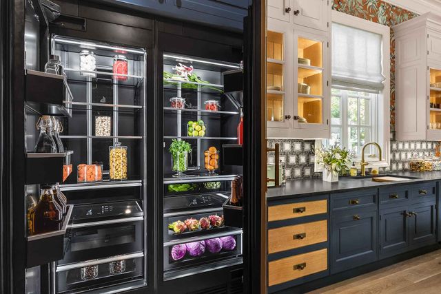 Front view of an opened side by side JennAir refrigerator