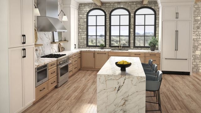 Credit: JennAir Front view of a luxury kitchen with JennAir panel ready appliances