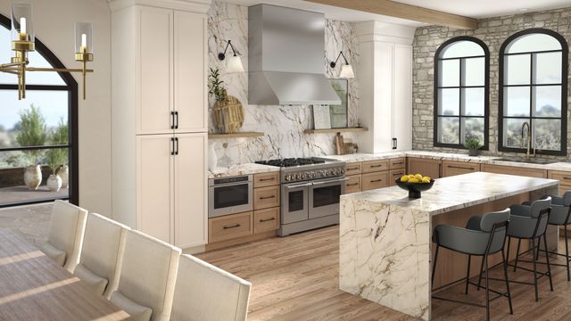 Front view of a modern kitchen with a JennAir range