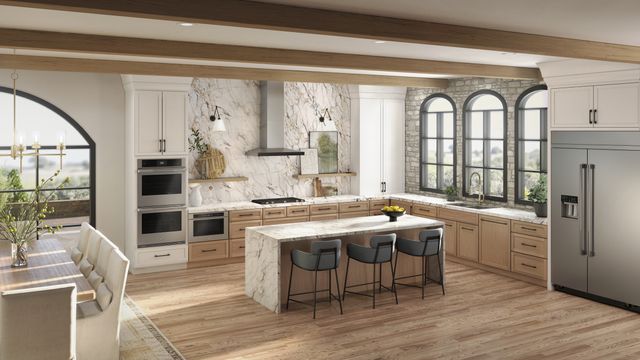 front view of a modern kitchen with stainless steel jennair appliances