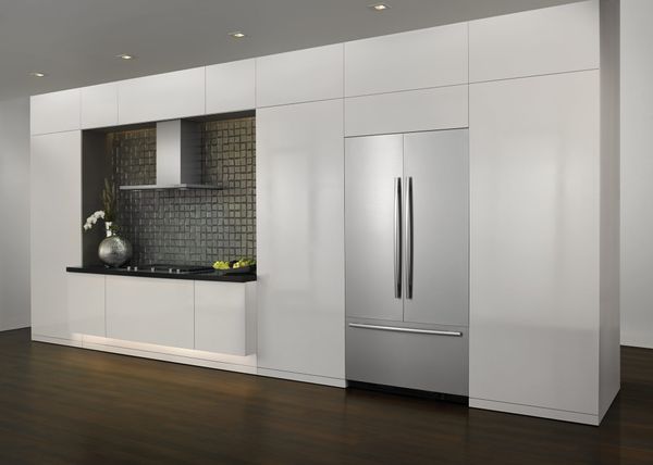 A JennAir refrigerator, range hood, and cooktop are shown in a modern, minimalist kitchen