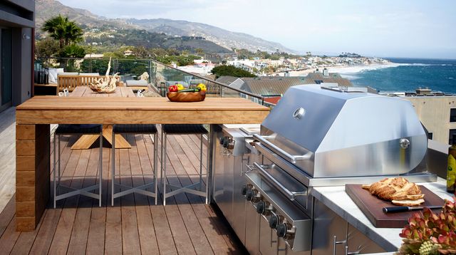 Front view of a modern outdoor cooking station with a Kalamazoo grill
